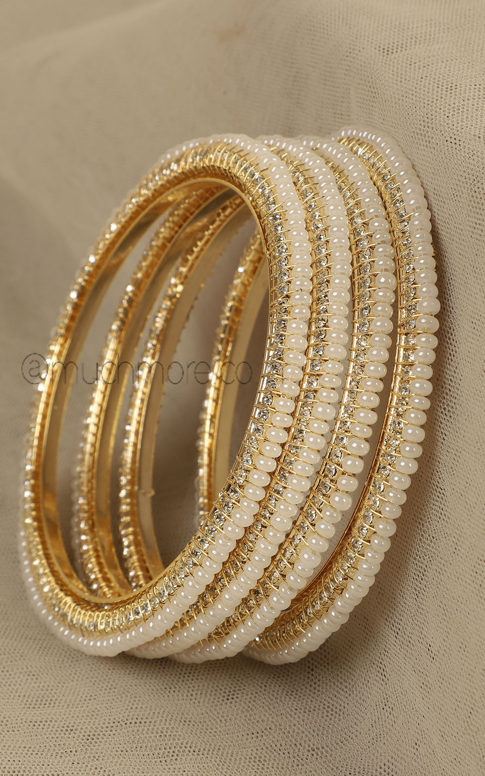Set Of 4 Sleek Pearl Bangles In Gold Polish
