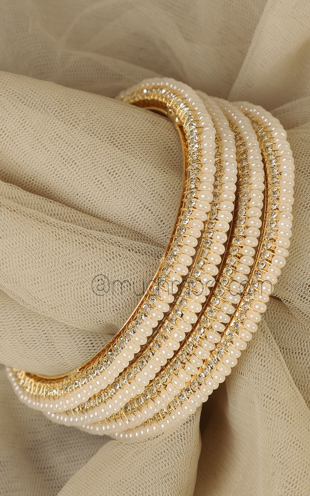 Set Of 4 Sleek Pearl Bangles In Gold Polish
