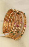 Sleek Gold Look Ruby Green Bangles Set Of 4